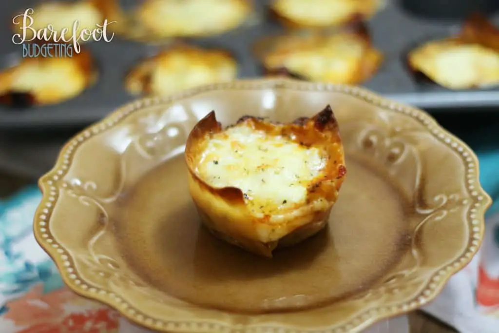 This easy baked lasagna cups recipe is sure to be a hit for the entire family! Serve it up as an appetizer or eat a few for an easy dinner!