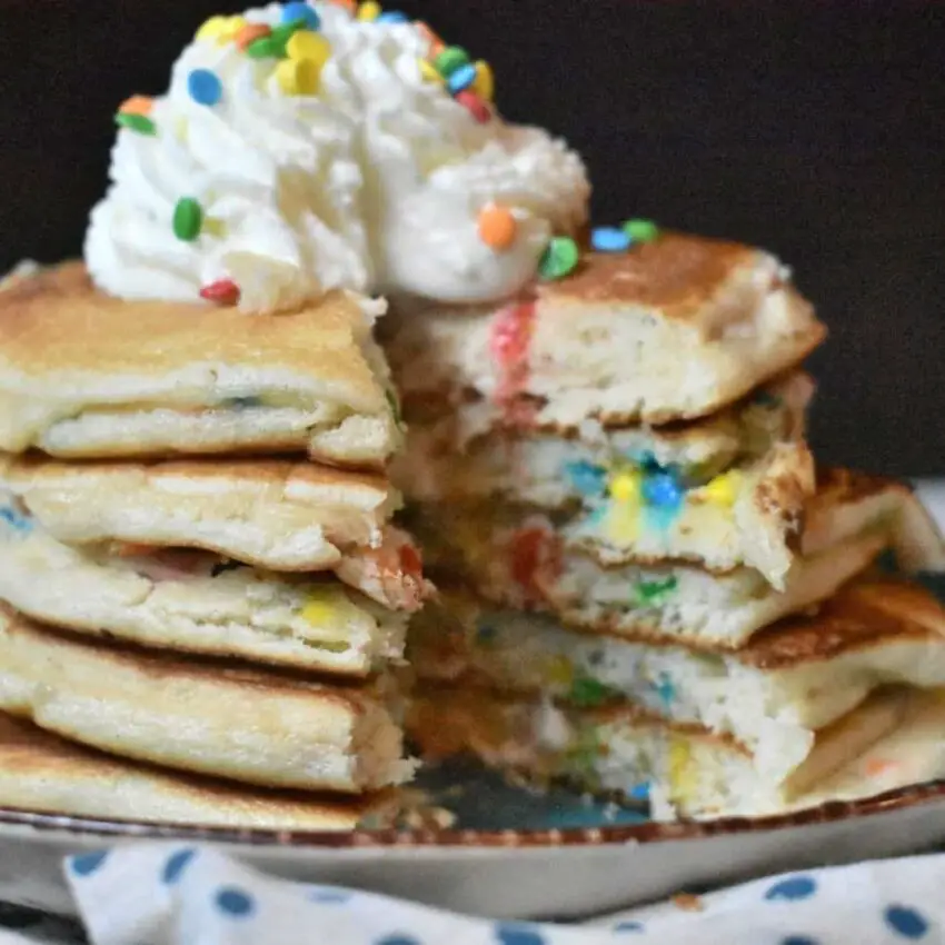 cake made in a pan is so easy, quick and can be a great way to save on freshness. picture is of a funfetti cake made in pan stacked to look like pancakes.
