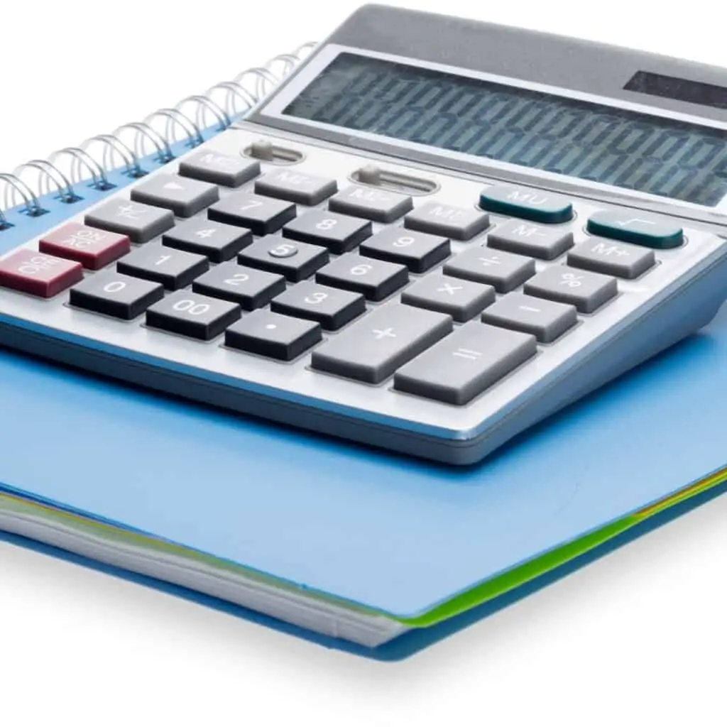 image: calculator on blue notebook (relocation calculator)